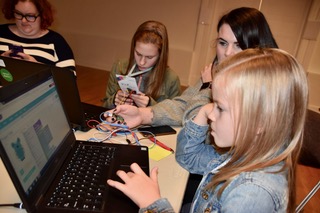 Girl coding on a laptop at Huddersfield Girl Geeks launch event
